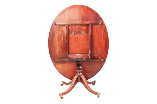 Lot 254 - A George III oval mahogany snap-top breakfast...