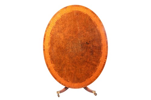Lot 254 - A George III oval mahogany snap-top breakfast...