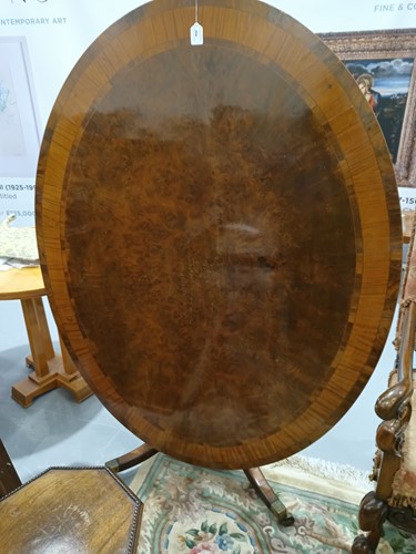 Lot 254 - A George III oval mahogany snap-top breakfast...