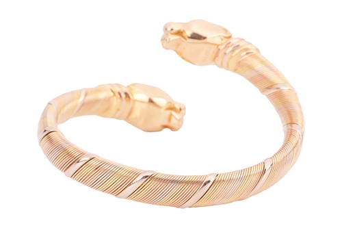 Lot 237 - Cartier - a Panthère cuff bracelet in 18ct...