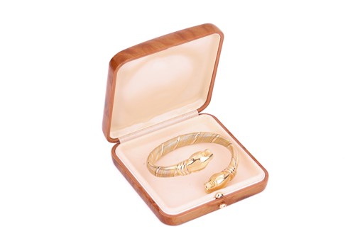 Lot 237 - Cartier - a Panthère cuff bracelet in 18ct...