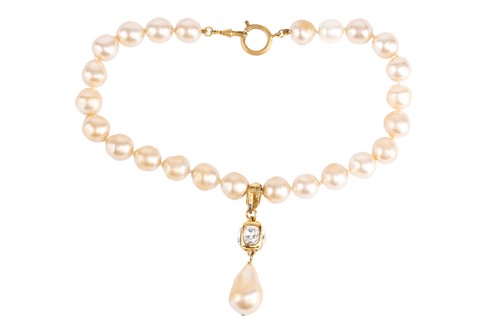 Lot 156 - Chanel - a faux pearl necklace, designed by...