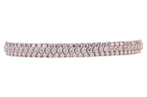 Lot 177 - A diamond line bracelet, comprising...