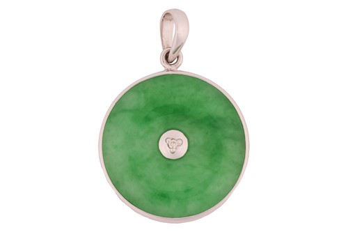 Lot A jadeite pendant, of bi disc form,...