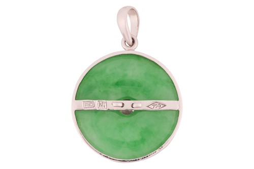 Lot 165 - A jadeite pendant, of bi disc form,...