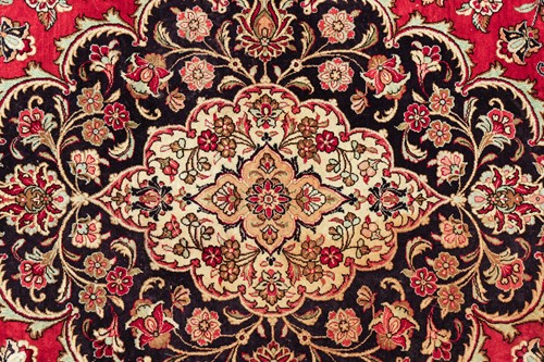 Lot 293 - A claret ground room size Qum silk on silk...