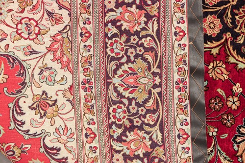 Lot 293 - A claret ground room size Qum silk on silk...
