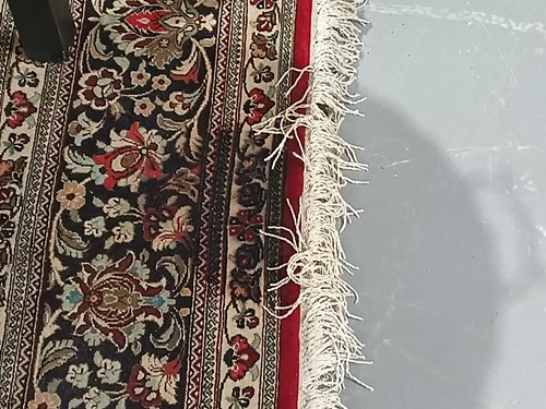 Lot 293 - A claret ground room size Qum silk on silk...