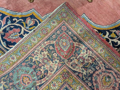 Lot 289 - A room size 'Antique' tomato red round Tabriz...