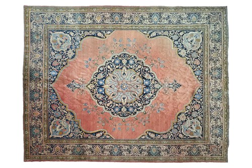 Lot 289 - A room size 'Antique' tomato red round Tabriz...