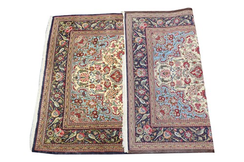 Lot 288 - An ivory ground Kerman carpet with a flower...