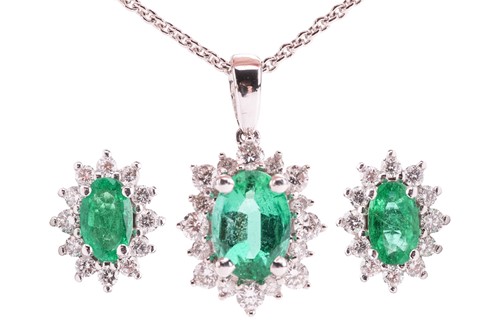 Lot An emerald and diamond cluster pendant and...