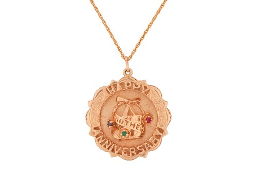 Lot A gem-set anniversary pendant on chain, the...