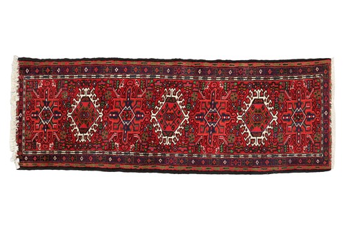 Lot 147 - A red ground Karaja strip runner with nice...