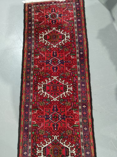 Lot 147 - A red ground Karaja strip runner with nice...