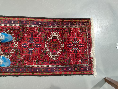 Lot 147 - A red ground Karaja strip runner with nice...