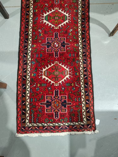 Lot 147 - A red ground Karaja strip runner with nice...
