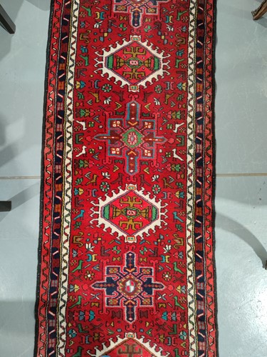 Lot 147 - A red ground Karaja strip runner with nice...