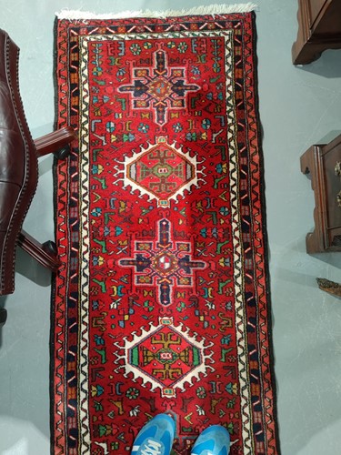 Lot 147 - A red ground Karaja strip runner with nice...