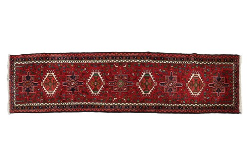 Lot 147 - A red ground Karaja strip runner with nice...