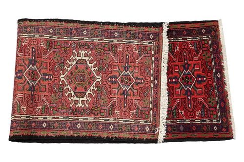 Lot 147 - A red ground Karaja strip runner with nice...