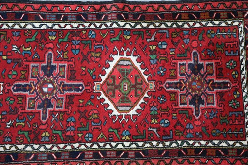 Lot 147 - A red ground Karaja strip runner with nice...