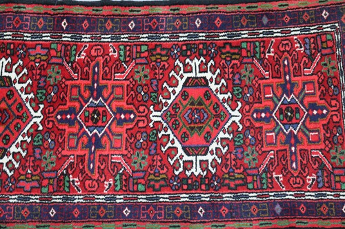 Lot 147 - A red ground Karaja strip runner with nice...