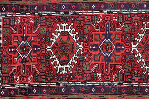 Lot 147 - A red ground Karaja strip runner with nice...
