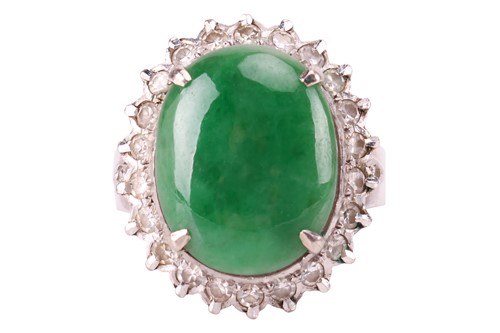 Lot 94 - A jade and diamond halo ring, comprising an...