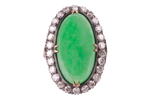 Lot 44 - A jade and diamond halo ring, featuring an...