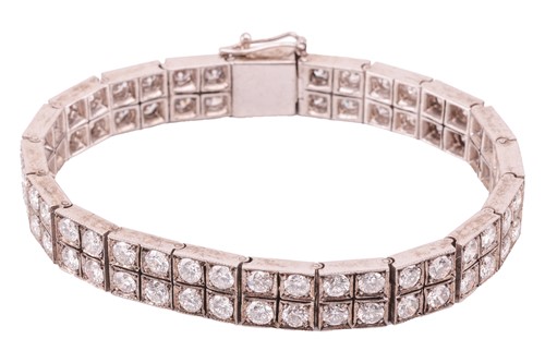 Lot 58 - A double-row diamond-set line bracelet,...