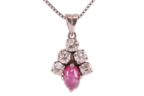 Lot 49 - A star ruby and diamond-set cluster pendant,...