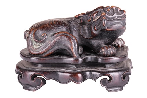 Lot A Chinese 18th-century style cast patinated...