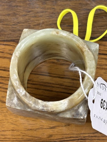 Lot 139 - A Chinese Neolithic style carved jade cong,...