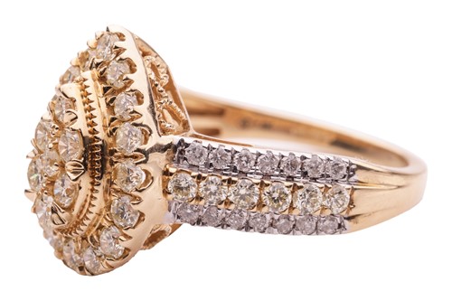 Lot 50 - A diamond cluster ring in 14ct gold, the...