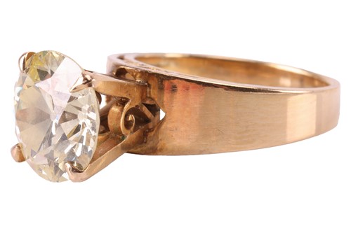 Lot 56 - A diamond solitaire ring, claw-set with a...