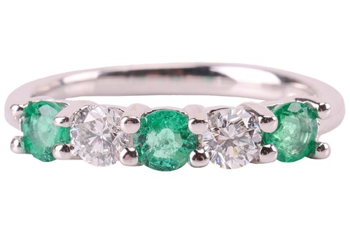 Lot An emerald and diamond five-stone ring,...