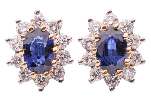 Lot 53 - A pair of sapphire and diamond cluster...