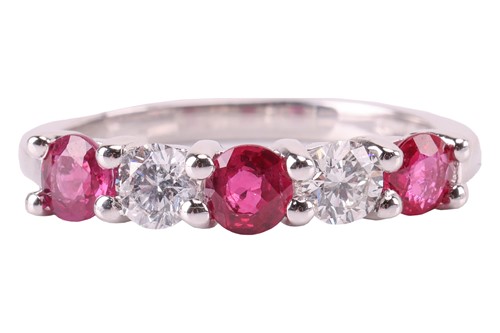 Lot A ruby and diamond five-stone ring, featuring...