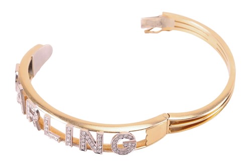 Lot 61 - A diamond-set 'Darling' hinged bangle,...