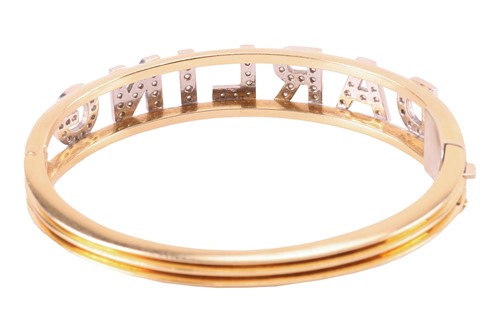 Lot 61 - A diamond-set 'Darling' hinged bangle,...