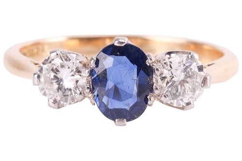 Lot 9 - A sapphire and diamond three-stone ring,...