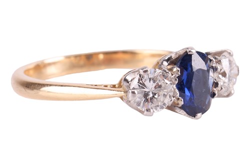 Lot 9 - A sapphire and diamond three-stone ring,...