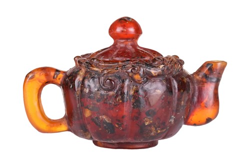 Lot 140 - A Chinese-carved amber scholar's water dripper...