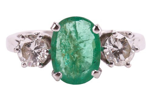 Lot 63 - An emerald and diamond three-stone ring in...