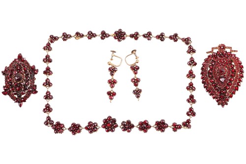 Lot 18 - A Victorian garnet suite comprising a necklace,...