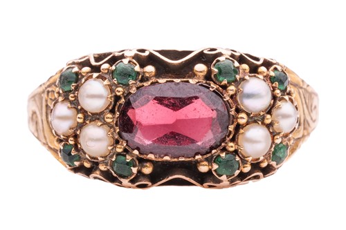 Lot 1 - A gem-set ring, the central oval-shaped garnet...