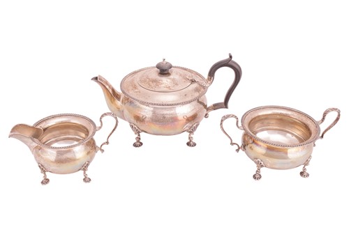 Lot 294 - A three-piece silver tea service, of round...