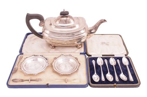 Lot 295 - A silver teapot, a pair of silver butter...