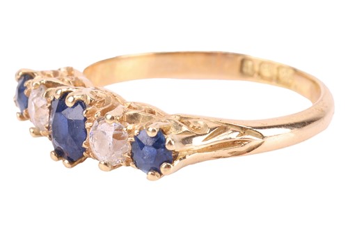 Lot 194 - An Edwardian sapphire and diamond half-hoop...